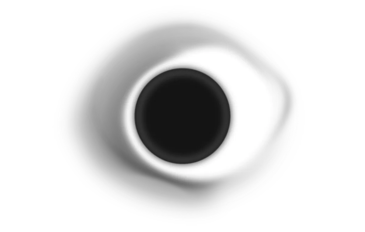 Aerial view of a black circular object surrounded by shadows, creating an impression of abstraction or mystery.
